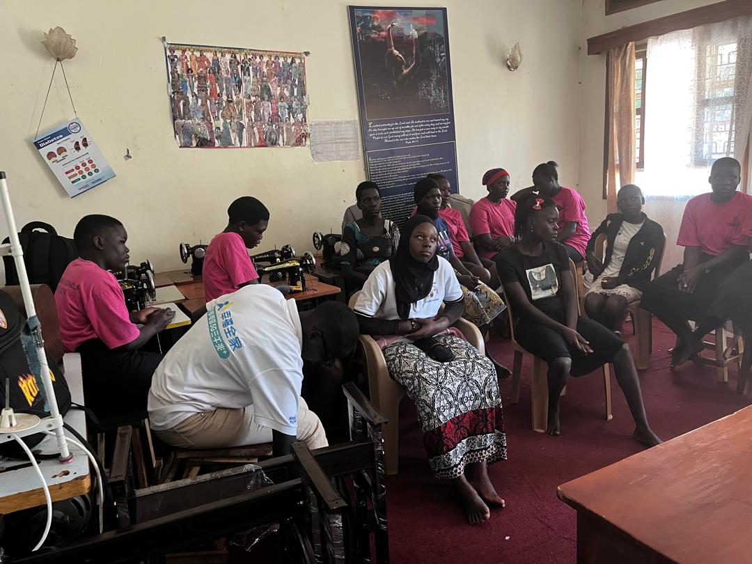 The tailoring workshop at Treasured Vessels Girls' Centre, with sewing machines and trainees at work